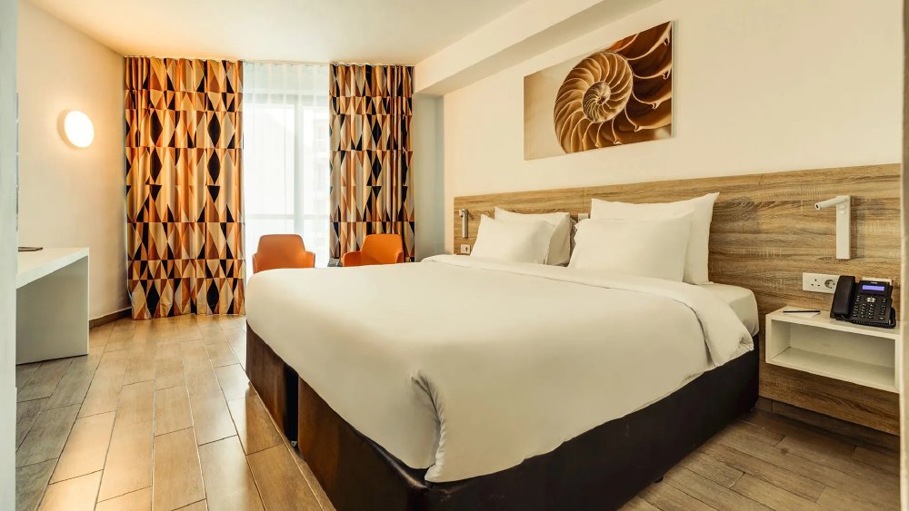 Vliegreis naar AX ODYCY Hotel – All inclusive aan de Qawra Promenade